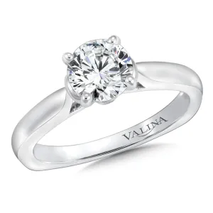 A polished cape design with surprise diamond adds a modern touch to this classic solitaire ring.